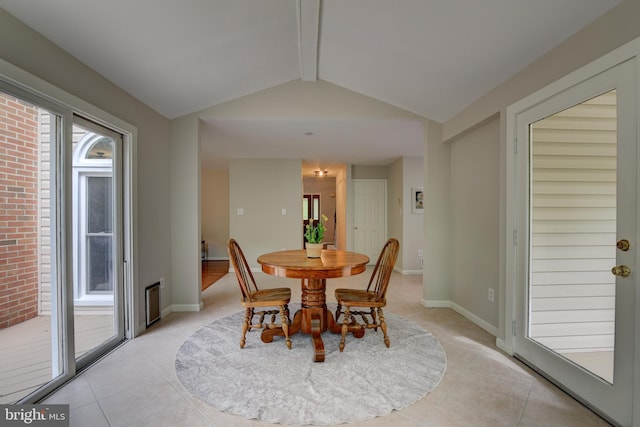 dining area with light tile patterned floors and baseboards