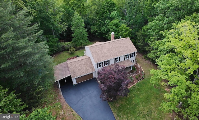 view from above of property with a forest