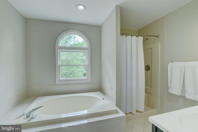 bathroom with a garden tub, a shower with shower curtain, vanity, and recessed lighting
