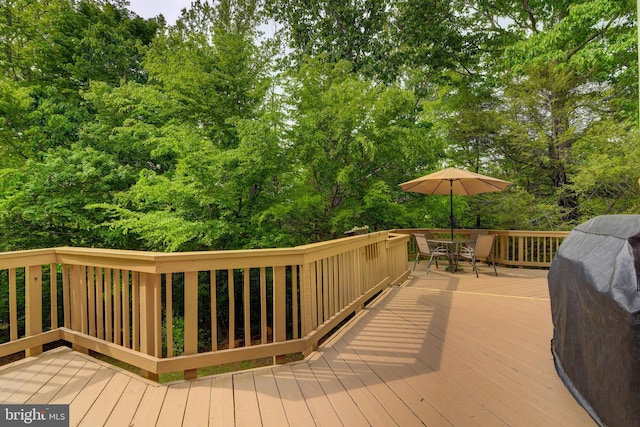 wooden deck featuring outdoor dining space