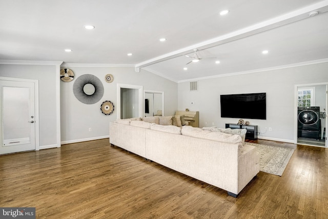 living room with dark wood-type flooring, ornamental molding, baseboards, and recessed lighting