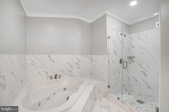 full bathroom with marble look tiles, a jetted tub, a shower stall, and recessed lighting