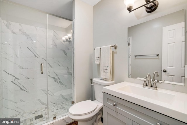 full bath featuring toilet, a marble finish shower, and vanity