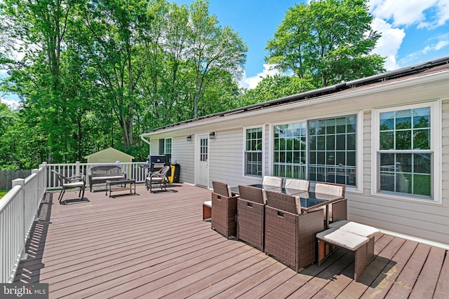 wooden terrace with outdoor dining space