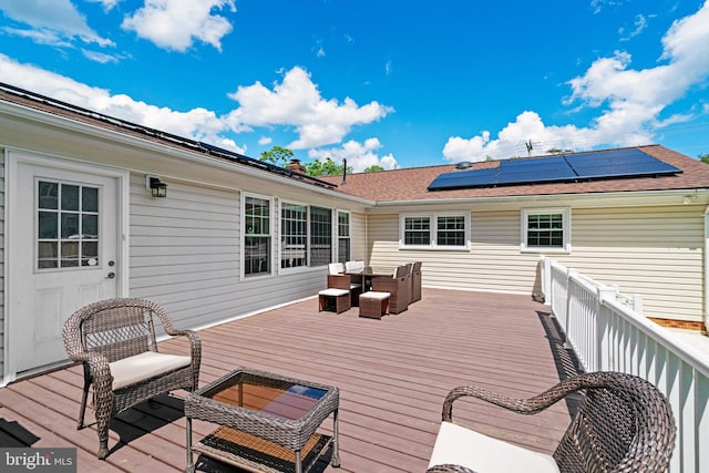 wooden deck with an outdoor living space