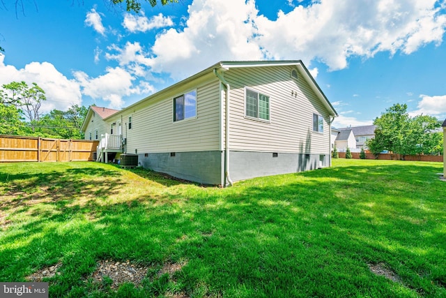 view of side of property with central AC unit