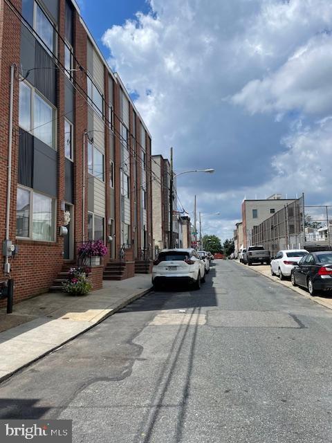 2557 Tilton St, Philadelphia, PA 19125 - view of asphalt road featuring street lighting, sidewalks, and curbs