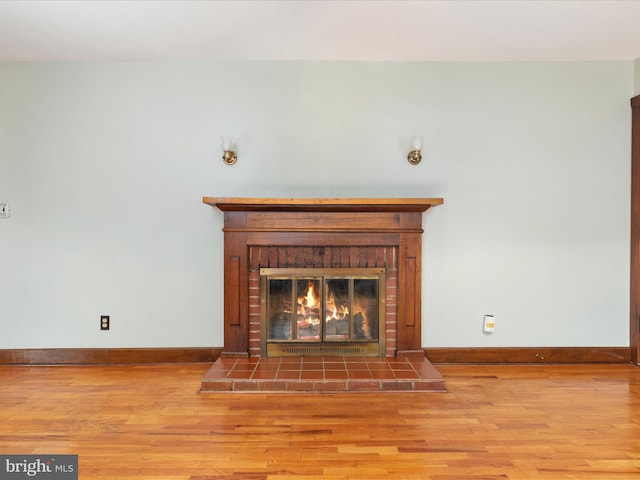 826 W 16th St, Front Royal, VA 22630 - detailed view of a brick fireplace, wood finished floors, and baseboards