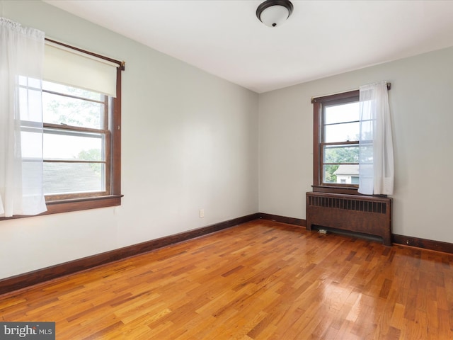 826 W 16th St, Front Royal, VA 22630 - spare room featuring radiator, light wood-type flooring, and baseboards