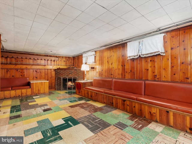 826 W 16th St, Front Royal, VA 22630 - playroom with healthy amount of natural light, tile patterned floors, wood walls, and a fireplace