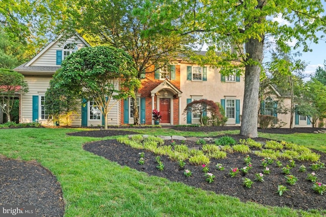 view of front of property with a front lawn