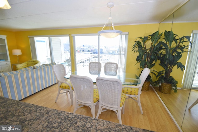107 Convention Center Dr Unit 148D, Ocean City, MD 21842 - dining area featuring wood finished floors and crown molding