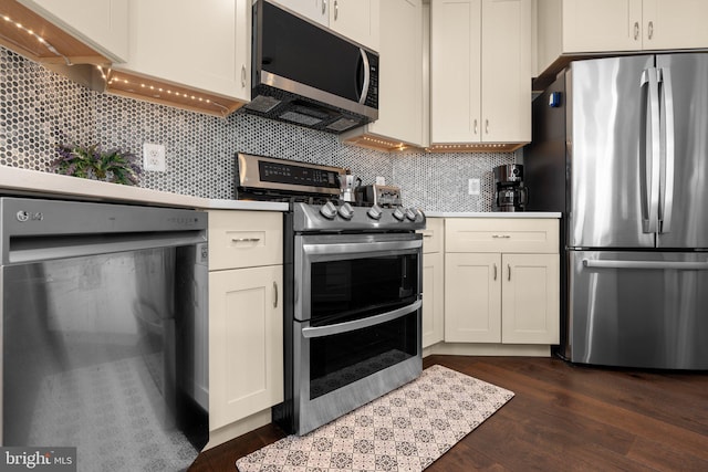 9480 Virginia Center Blvd Unit 239, Vienna, VA 22181 - kitchen featuring stainless steel appliances, dark wood-style floors, backsplash, and white cabinetry