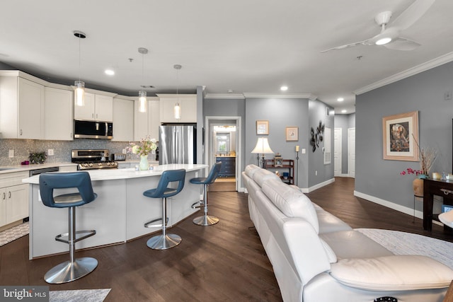 9480 Virginia Center Blvd Unit 239, Vienna, VA 22181 - kitchen with stainless steel appliances, crown molding, light countertops, decorative backsplash, and dark wood-style flooring