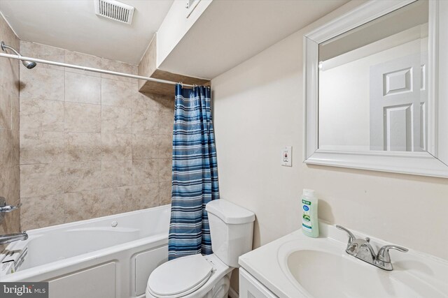 1934 Cecil B Moore Ave, Philadelphia, PA 19121 - bathroom with shower / bath combination with curtain, toilet, and vanity