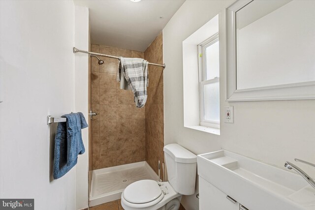 1934 Cecil B Moore Ave, Philadelphia, PA 19121 - bathroom with tiled shower, toilet, and vanity