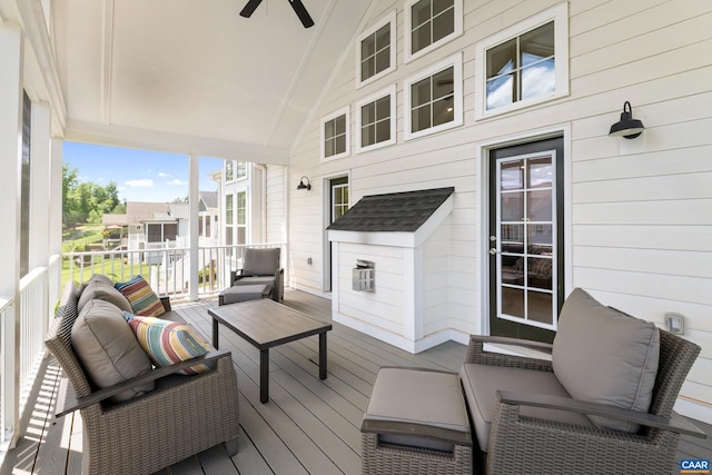 deck featuring ceiling fan and an outdoor living space