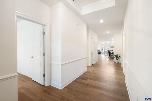 hall featuring wood finished floors, recessed lighting, and baseboards