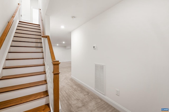 stairway featuring carpet, recessed lighting, and baseboards