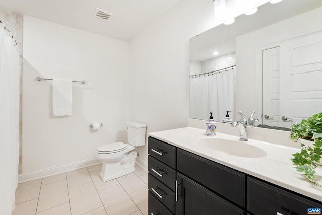 bathroom featuring baseboards, tile patterned floors, toilet, vanity, and a shower with shower curtain