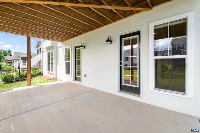 view of patio featuring fence
