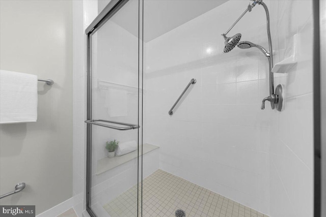 full bath featuring a shower stall