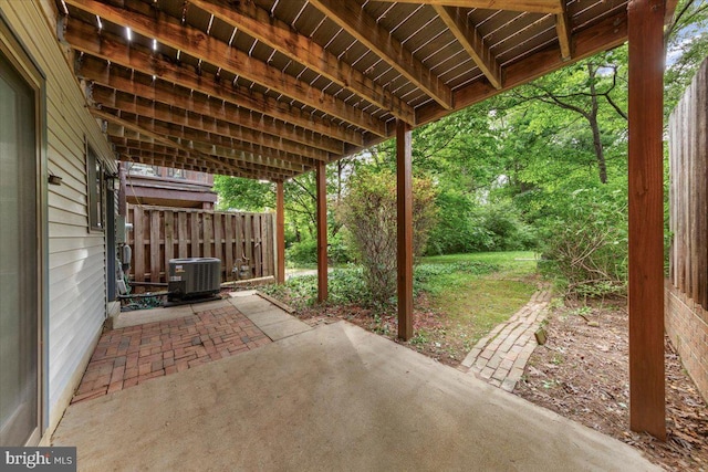 view of patio / terrace with cooling unit and fence