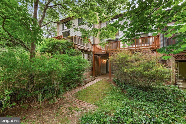 view of yard with a wooden deck