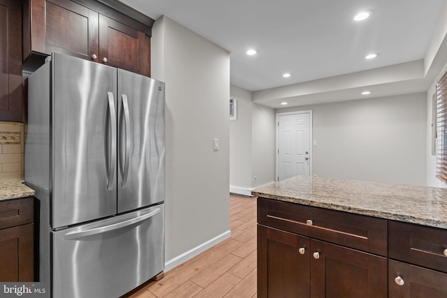 9 Queens Bridge Rd, Levittown, PA 19057 - kitchen with freestanding refrigerator, light wood finished floors, dark brown cabinetry, recessed lighting, and light stone countertops