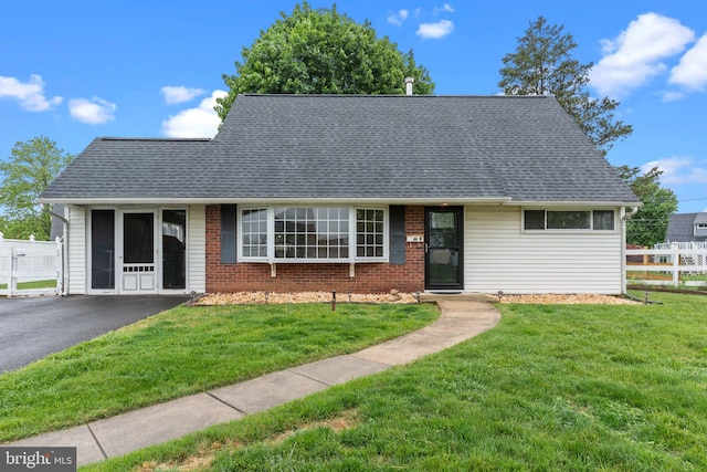 9 Queens Bridge Rd, Levittown, PA 19057 - view of front of home featuring roof with shingles and brick siding