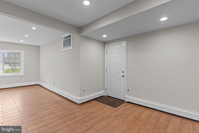 9 Queens Bridge Rd, Levittown, PA 19057 - spare room featuring a baseboard heating unit, recessed lighting, wood finished floors, and baseboards