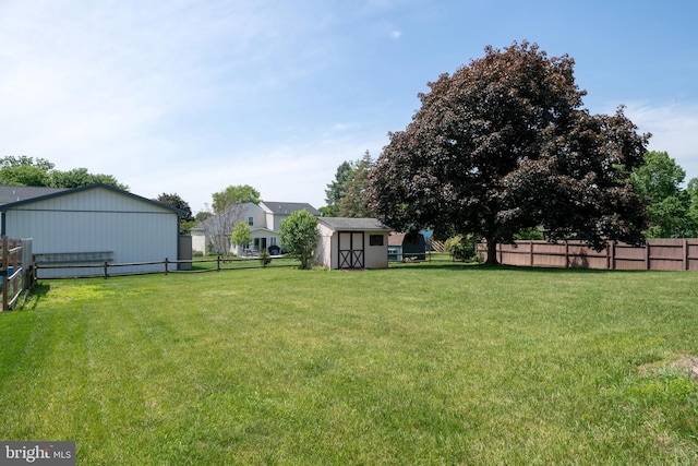 view of yard with an outbuilding and a shed