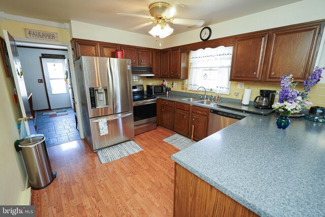 117 Mimosa Dr, Cambridge, MD 21613 - kitchen featuring stainless steel appliances, a sink, under cabinet range hood, and healthy amount of natural light
