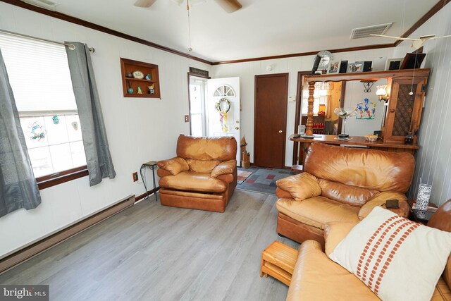 117 Mimosa Dr, Cambridge, MD 21613 - living room with wood finished floors, ornamental molding, and ceiling fan