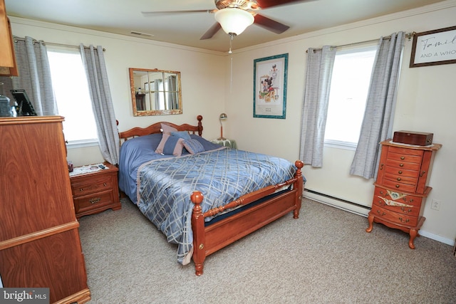 117 Mimosa Dr, Cambridge, MD 21613 - carpeted bedroom featuring a baseboard heating unit, a ceiling fan, and ornamental molding
