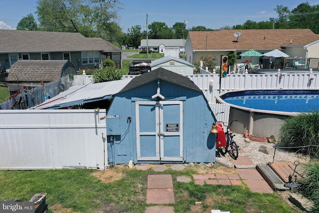 117 Mimosa Dr, Cambridge, MD 21613 - view of shed featuring a fenced backyard and an outdoor pool