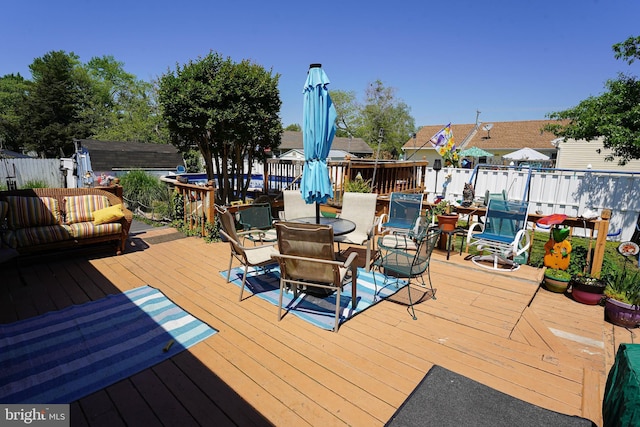 117 Mimosa Dr, Cambridge, MD 21613 - deck featuring outdoor dining area and fence