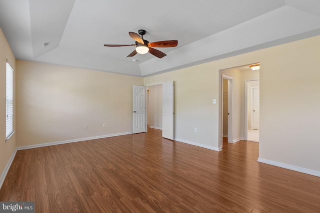 2024 Baythorne Rd, Prince Frederick, MD 20678 - spare room featuring a tray ceiling, a ceiling fan, wood finished floors, and baseboards