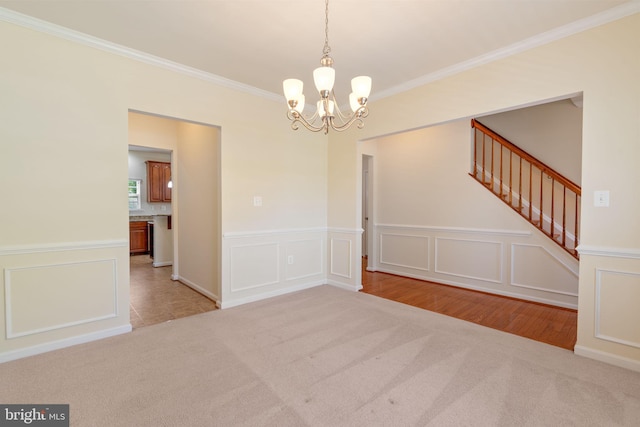 2024 Baythorne Rd, Prince Frederick, MD 20678 - unfurnished dining area with carpet flooring, crown molding, a chandelier, stairs, and a decorative wall