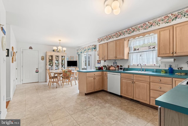 3135 Windon Ave, Lancaster, PA 17603 - kitchen with white dishwasher, a sink, a chandelier, and plenty of natural light