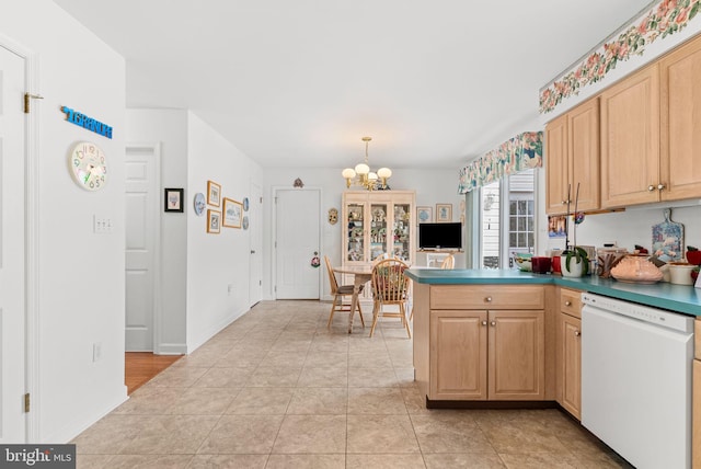 3135 Windon Ave, Lancaster, PA 17603 - kitchen featuring white dishwasher, a peninsula, light brown cabinets, and a chandelier