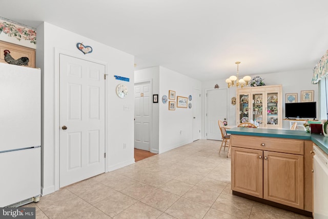3135 Windon Ave, Lancaster, PA 17603 - kitchen featuring freestanding refrigerator, a chandelier, light tile patterned flooring, and light brown cabinets