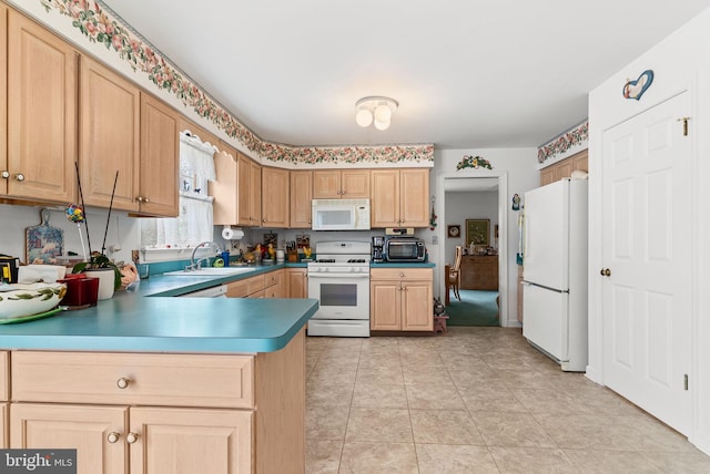 3135 Windon Ave, Lancaster, PA 17603 - kitchen featuring white appliances, a sink, a peninsula, and light brown cabinets