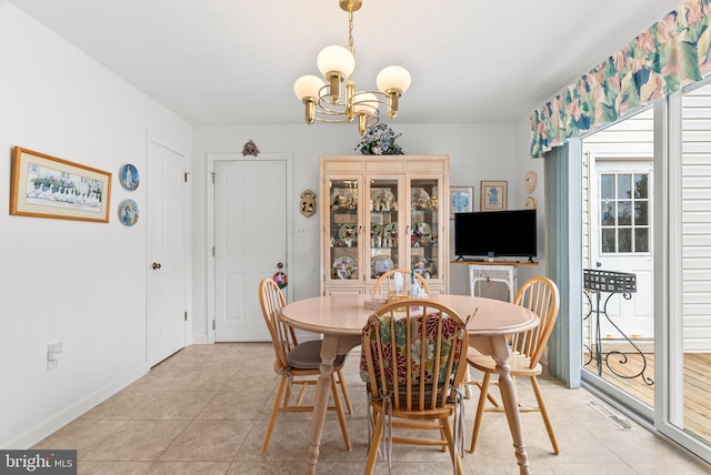 3135 Windon Ave, Lancaster, PA 17603 - dining room with a chandelier, light tile patterned flooring, and baseboards