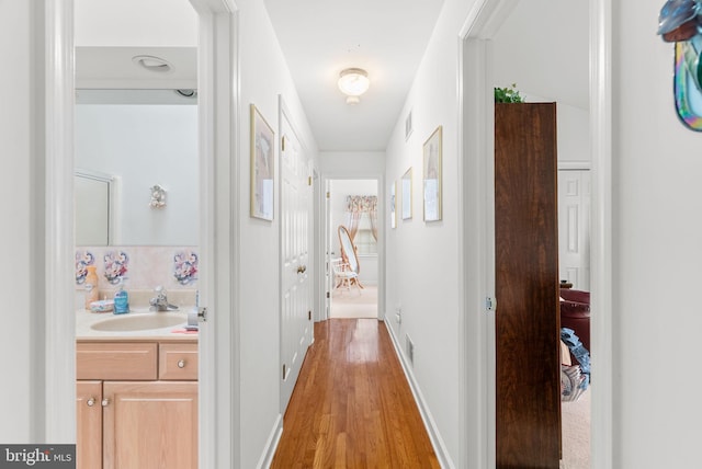 3135 Windon Ave, Lancaster, PA 17603 - hallway with a sink and light wood-type flooring