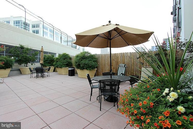 38 Maryland Ave Unit 512, Rockville, MD 20850 - view of patio / terrace with outdoor dining space and fence