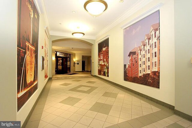 38 Maryland Ave Unit 512, Rockville, MD 20850 - hallway with tile patterned flooring, arched walkways, ornamental molding, and baseboards