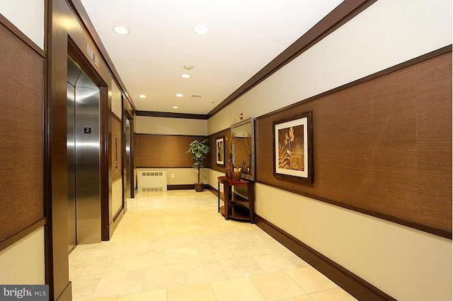 38 Maryland Ave Unit 512, Rockville, MD 20850 - hallway with elevator, radiator heating unit, ornamental molding, baseboards, and recessed lighting