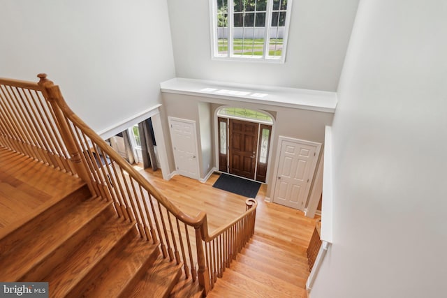 1311 Meadowbrook Ct, Jenkintown, PA 19046 - foyer featuring a towering ceiling, light wood-type flooring, baseboards, and stairs
