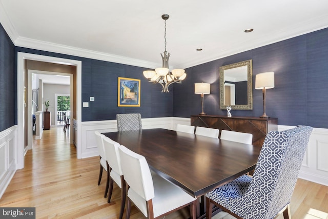 1311 Meadowbrook Ct, Jenkintown, PA 19046 - dining room featuring a chandelier, ornamental molding, light wood-style flooring, wainscoting, and a decorative wall